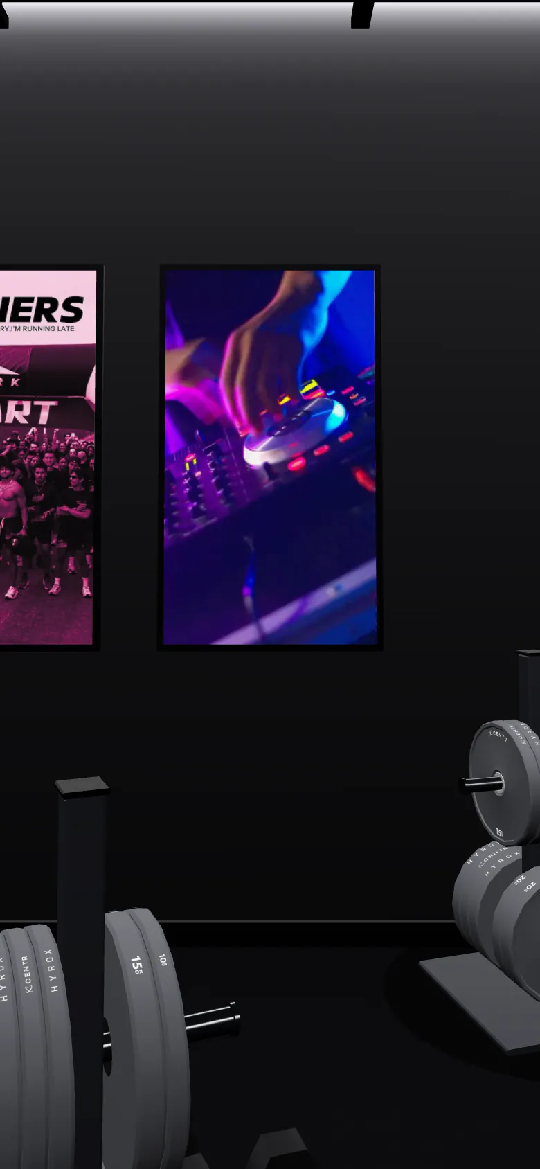 Three lit posters of the WORKCLUB USA crew on the gym wall